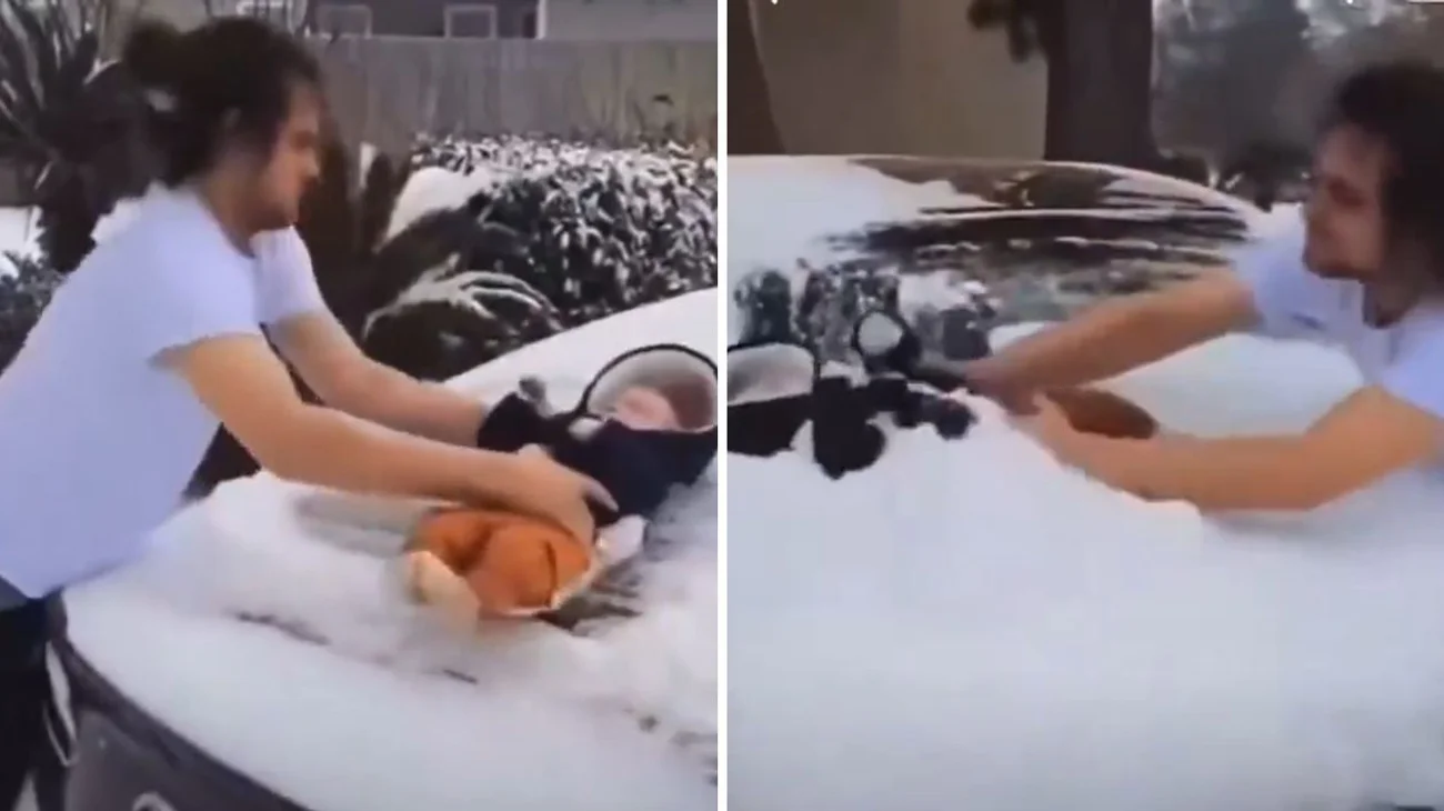 Hombre usa a su bebé de tres meses para quitar la nieve del auto